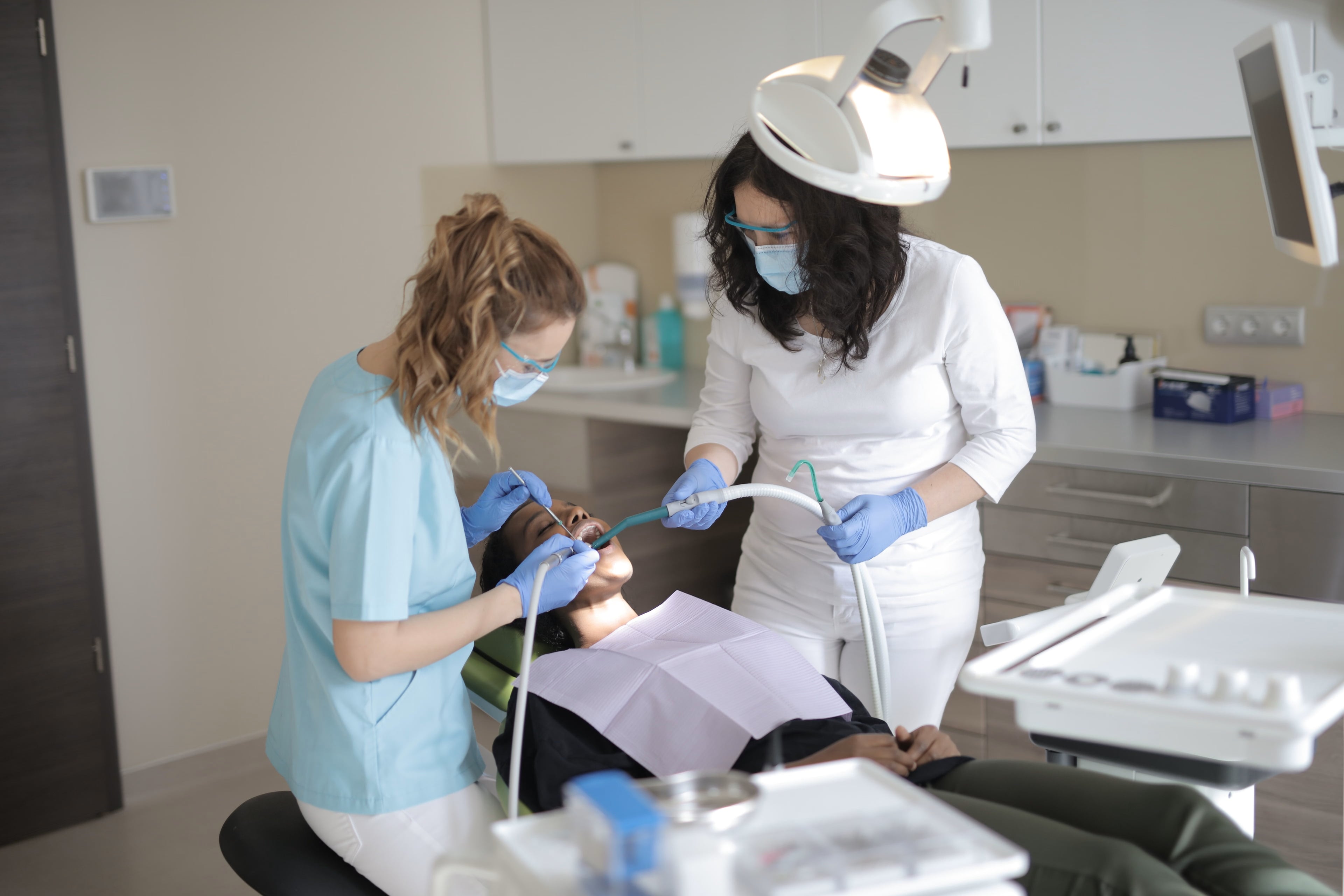 Dentist reviewing results with a happy patient in a modern dental office